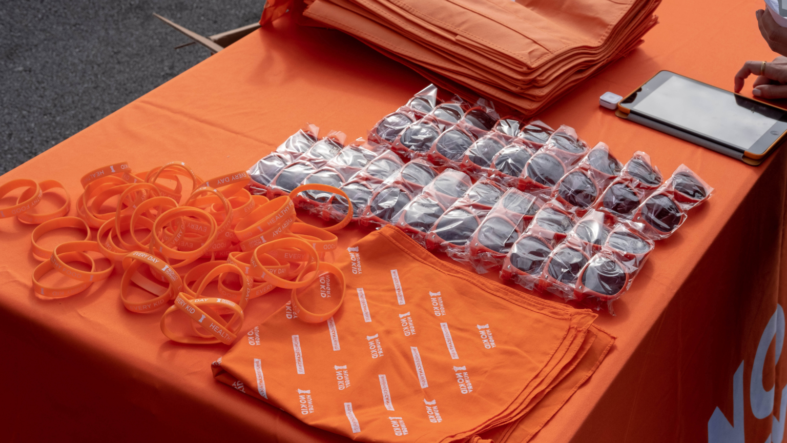 L A I Video No Kid Hungry Merch Table