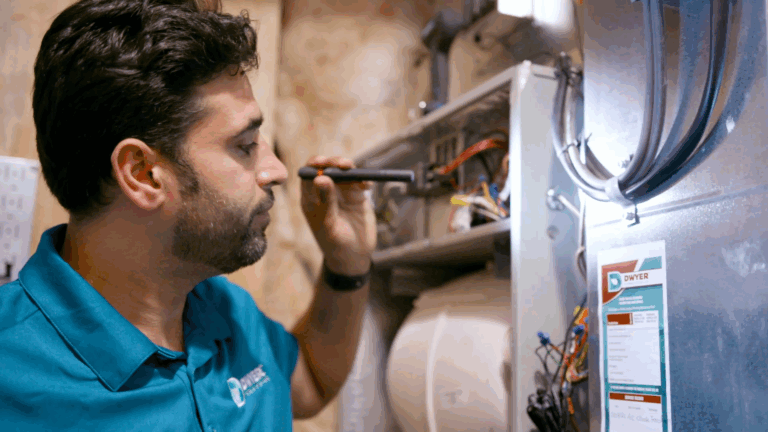 Dwyer Plumber Inspecting Pipes
